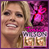 A static icon featuring a smiling woman with blonde hair, pink text reading 'torrie', and 'WILSON' in bold black letters over a purple background with a pink bow graphic.