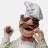 Pixelated animated icon featuring a character with chef's hat and raised fist next to pixelated text reading "This icon is a-okee dokee" on white background.