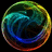 A circular pixelated icon with a swirling gradient of green, yellow, blue, and red hues against a black background.