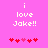 Pixelated text 'i love Jake!!' on bright pink background with red and pink heart symbols below.
