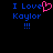 Blue pixelated text 'I Love Kaylor !!!' with a pink heart symbol replacing the 'o' in 'Love', displayed on black background.