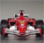 Red and white racing car with black accents on a gray background, viewed from a low angle.
