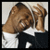 Pixelated image of a person with brown skin wearing white and black clothing, next to bold white text reading USHER on a black background.