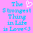 Pixelated text on pink background with blue letters and white heart symbol, two identical versions side-by-side.