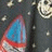 Dark background with repeating white skull icons and blue-red triangular shapes, featuring animated heart symbols in red, blue, and white.