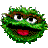 Two side-by-side pixelated green cartoon faces with brown eyebrows, white eyes, black mouths, and red tongues on a gray background.
