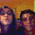 Two people in a pixelated image with changing facial expressions across four , set against an orange background