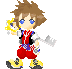 Pixelated character with brown spiky hair, blue eyes, red shorts, yellow shoes, and a key-shaped weapon holding a golden object.