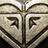 Pixelated icon shows symmetrical stone-like mask with angular eyes and curved brow, next to black background with yellow text reading "I Love Roxy Chicks".