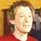 repeated character portraits in red shirts against a yellow background with visible text at bottom right