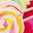 Pixelated abstract composition with swirling yellow, pink, and red shapes against a light background with green and blue accents.