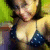 A person in a dark blue bikini top with white dots poses against a green background, showing subtle changes in head position and facial expression across frames.