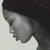 Pixelated grayscale profile of a person with dark hair, facing left, against a light background.
