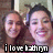 Two women pose together in a pixelated image with text overlay; the right woman wears a pink top and both have dark hair.