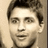 A pixelated image of a person with short dark hair on the left, next to white blocky text and symbols on a black background.