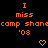 Orange pixelated text on black background reads 'I miss camp shanecamp shane '08' with two orange heart symbols below.