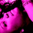 Pixelated close-up of a pink-toned face with dark hair, mouth open in a shout or scream, against a black background.