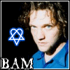 A person in a blue shirt appears with changing blue symbols above their head and 'BAM' text below, all on black background.