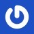 A circular white icon with a blue center on a solid blue background, featuring pixelated edges and no visible text or additional elements.