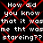 Black background with red X-shaped lines overlaid on repeated white pixelated text reading 'How did you know that it was me that was staring?? staring??' in a pattern