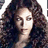 Pixelated image of a person with long curly hair, red text reading 'Beyonce Knowles', 'Obsessed', 'April', and '24,2009' on black and gray backgrounds.