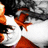 A pixelated image of a person with dark hair and orange clothing, partially obscured by white shapes.