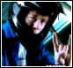 Animated sequence showing a figure in blue and black clothing making hand gestures, with text changing from 'BORUNE' to 'BORUNE BUSTED'.