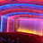 A static image of horizontal color bands in red, blue, purple, and yellow hues with pixelated edges and no discernible subjects or text.
