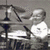 Animated sequence showing a drum kit, a boy in a toilet bowl, and a crying child's face.