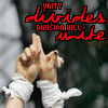 A static image shows two hands with white bandages making a gesture, overlaid with red pixelated text reading "UNITY divides DIVISION HILL."