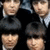 Four pixelated figures in dark suits and white shirts appear on a black background with blue text reading THE BEATLES.