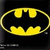 Yellow bat-shaped symbol with rounded edges on black background, rendered in pixelated style.