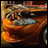 Animated sequence of a metallic orange sports car with silver alloy wheels, shown from front to side angles against blurred background.