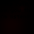 Dark background with repeated faint text reading "is cute do you think i'm listening" in a dim, low-contrast style.