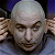 Pixelated close-up of a bald figure with light skin, dark eyebrows, and blue eyes against a blurred background.