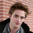A pixelated image of a person with light brown hair in front of a brick wall, transitioning to a group photo and then a close-up of two people.