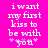 Pixelated text on bright pink background reads 'i want my first kiss to be with *you*' in white lowercase letters, with asterisks flanking 'you'.
