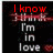 Red text 'I know' appears above white text 'I'm in love', with a red heart symbol and pixelated blur effect on black background.
