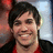 A pixelated image of a person with dark hair and a red shirt, with red text reading 'pete wentz is sexy' on a light background.