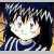 Pixelated image of a character with dark hair and light skin, wearing a dark outfit with white accents, set against a blurred background with yellow and blue tones.