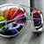 A circular icon with a rainbow gradient background and silver border, showing subtle animation changes in the central colorful pattern.