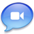 Blue speech bubble icon with white video camera symbol centered inside, rendered in pixelated style with gradient shading.