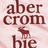 Pixelated red text on light pink background with small deer icon between lines.