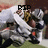 A pixelated image of a football player in white uniform with orange accents, captured from multiple angles showing different names above the figure.