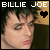 A pixelated contact sheet of two frames from an animated AIM buddy icon featuring Billie Joe Armstrong with text and symbols.