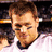 A split-screen image shows a person in a white jersey on the left and a New England Patriots logo on the right.