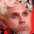 A pixelated contact sheet of two frames showing a character with blonde hair and red clothing on the left, next to bold red text reading "did my pin get in the way of your ass?" on a black background.