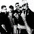 Pixelated collage of multiple distinct images including band members, a bus, and stylized faces