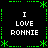 A static pixel art image with four identical text blocks arranged in a , each displaying 'I LOVE RONNIE' in white block letters on black background surrounded by green decorative borders