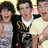 Three young men stand together on the left; a green background with blue pixelated text reads "I <3 the JONAS BROTHERS !!!!!!!" on the right.